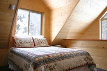 One of three comfy queen beds at Ridgerunner Cabin, Taos Ski Valley